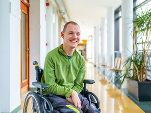 Disabled man in wheelchair smiling