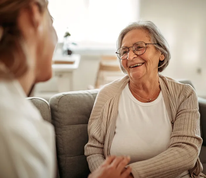 Female doctor consulting her senior patient