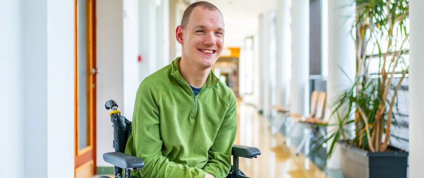 Disabled man in wheelchair smiling
