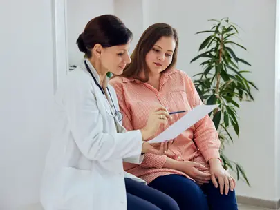 Doctor talking with patient about health information